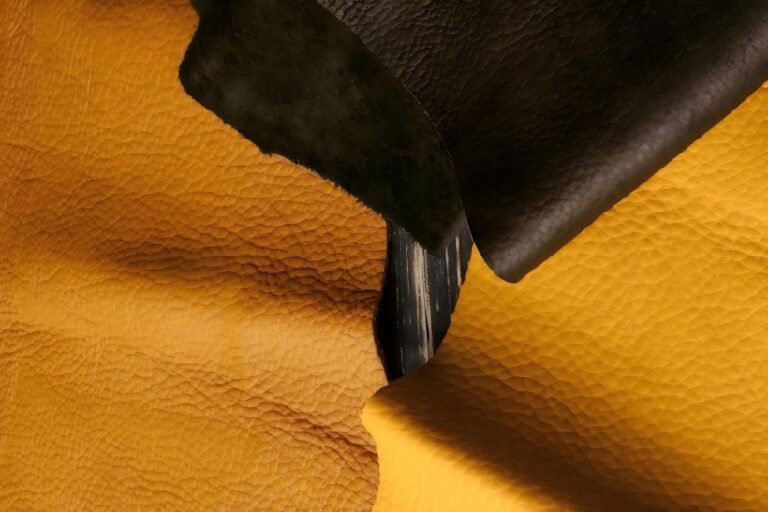 orange black lychee leather stack closeup